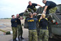 Extracting Cpl Campbell on the stretcher from a Leopard C2 tank